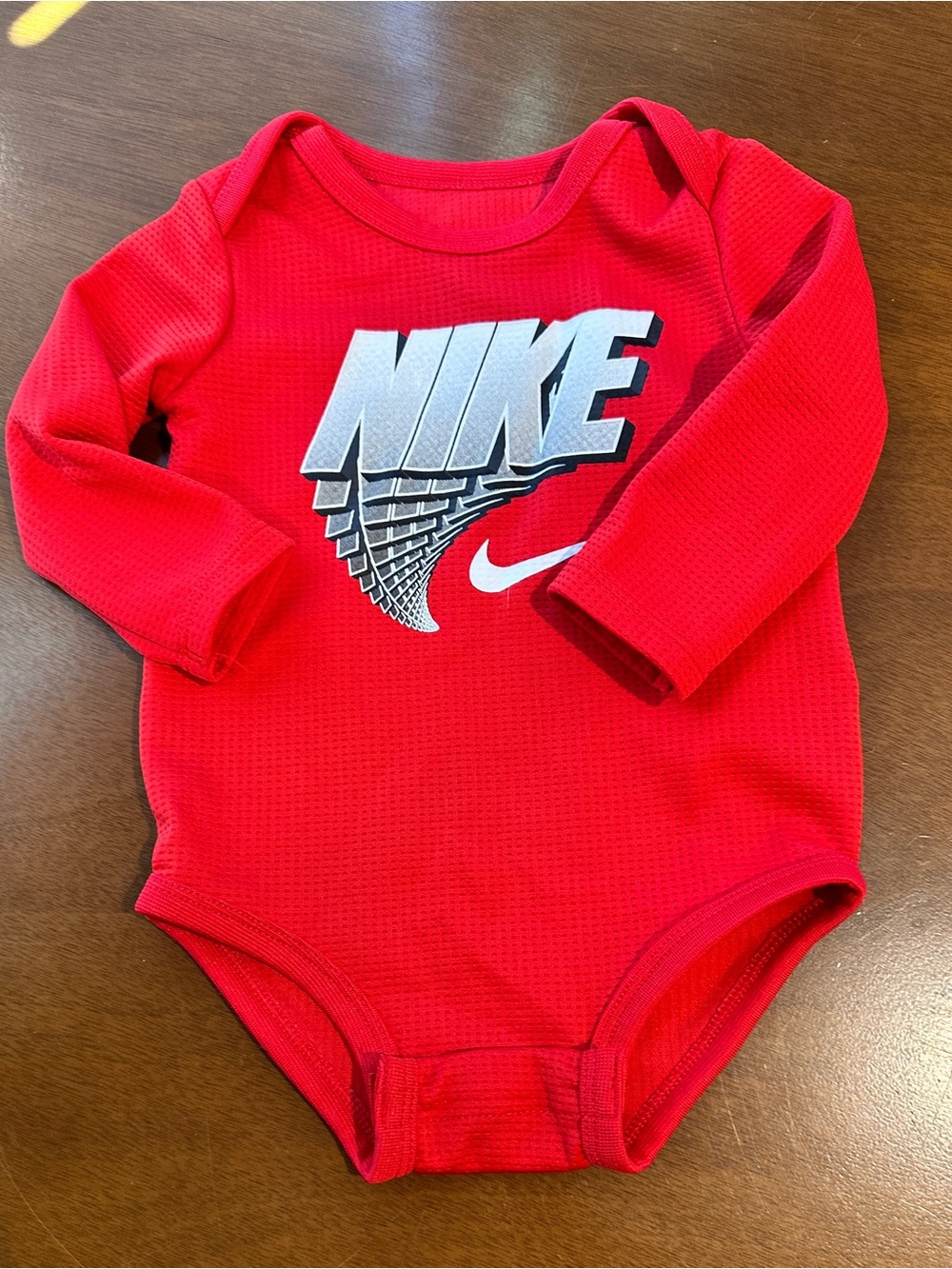Nike Red Long-Sleeve Baby Bodysuit with Silver Logo